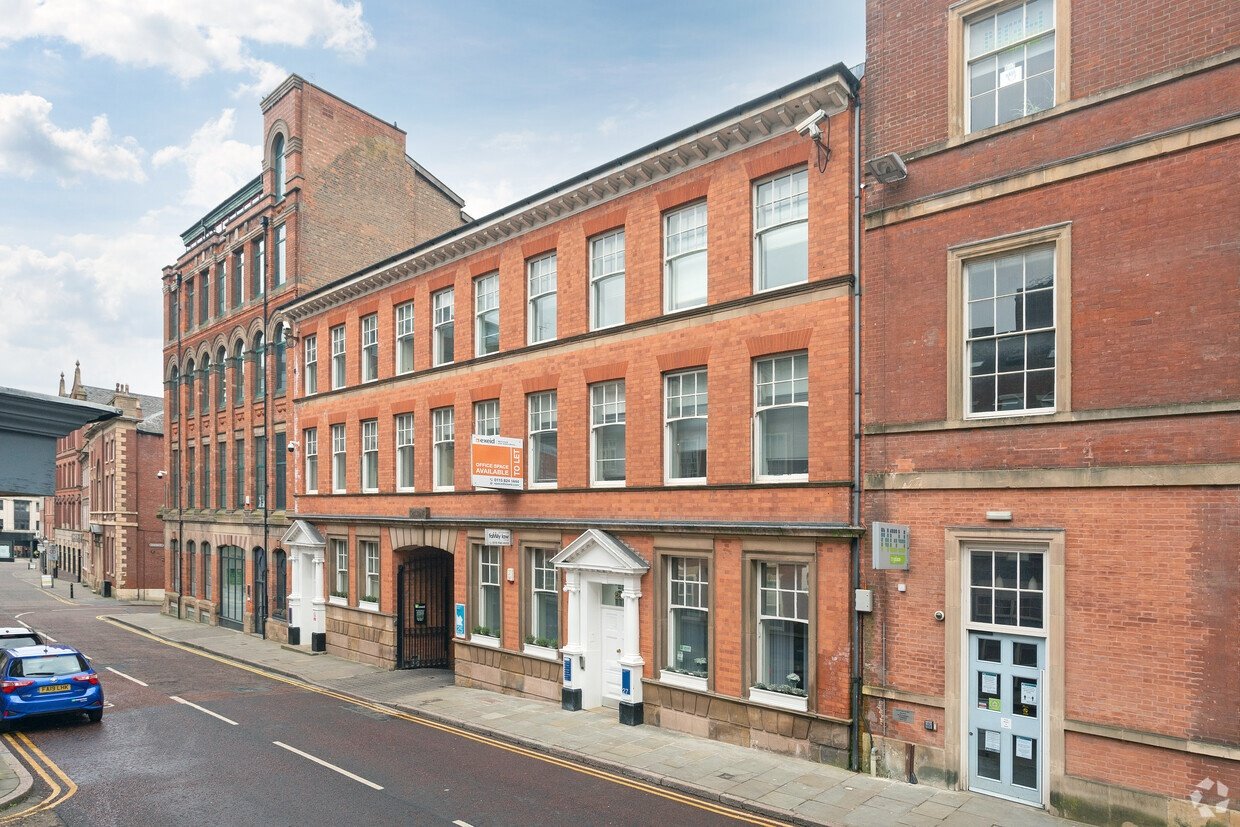 Red-brick Exeid office building in Nottingham with an office space to let sign